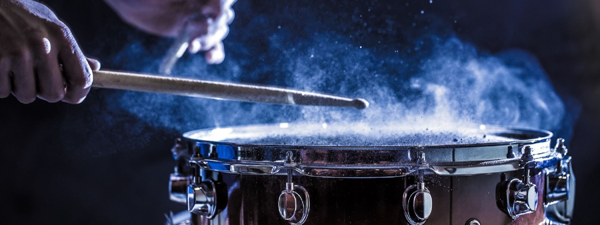 Man plays musical percussion instrument with stick 2021 08 31 12 05 38 utc